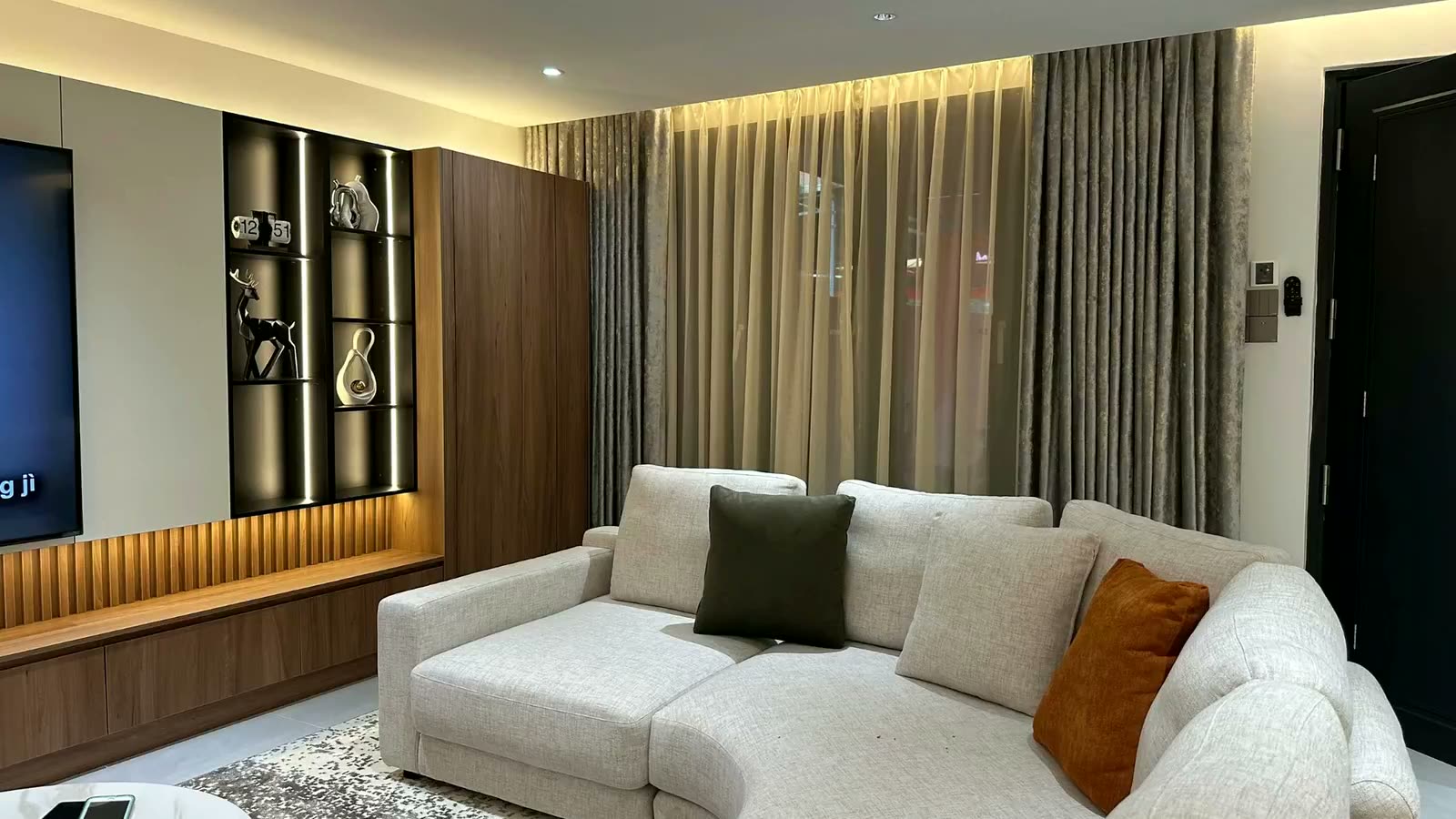 Ni-Shin Curtain real completed living room installation featuring custom curtains and sheers